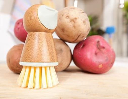 wooden scrubber with sweet potatoes